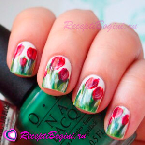 Фото: Праздничный дизайн ногтей на 8 марта с красными тюльпанами